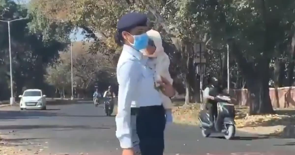woman traffic police with baby